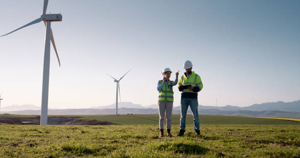 istock Business people, engineers or tablet with wind turbine for renewable energy, generation or reproduction system. Man, woman or contractors on technology for eco friendly resources or alternative power 2178507805