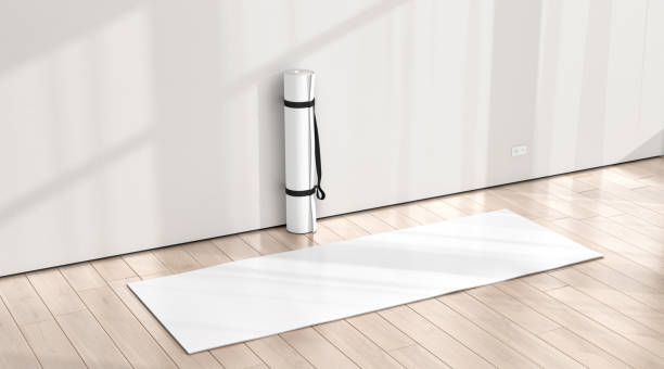 Blank white rolled unfolded yoga mat in sport area mockup