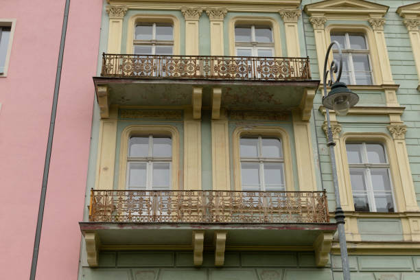 istock A green and yellow building with a lovely secondfloor balcony 2178508472