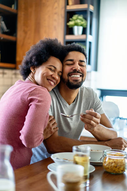 istock Happy couple having breakfast together in the kitchen 2178509344