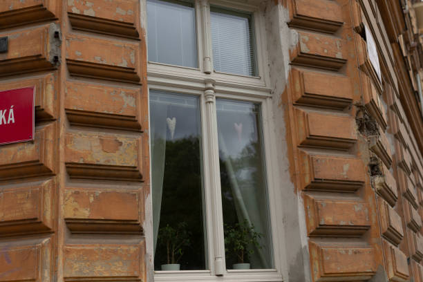 istock A window located on the side of a building featuring a red sign 2178510656