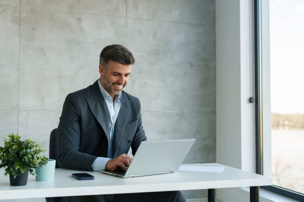 istock Professional Mid Adult Businessman Working at a Modern Office 2178513101