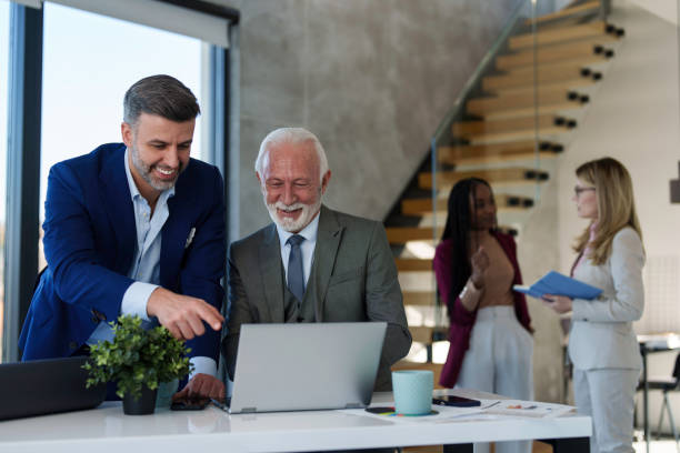 istock Caucasian Businessmen Engage in Laptop Work 2178513272