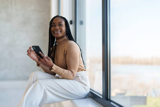 istock Professional Black Businesswoman Using Smartphone in Office Environment 2178513309