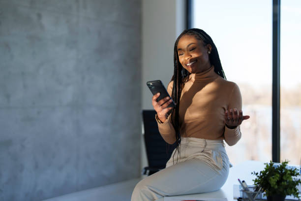istock Professional Black Businesswoman Using Smartphone in Office 2178513311