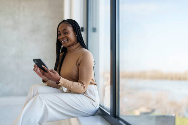 istock Confident Black Businesswoman Using Smartphone in Office 2178513313