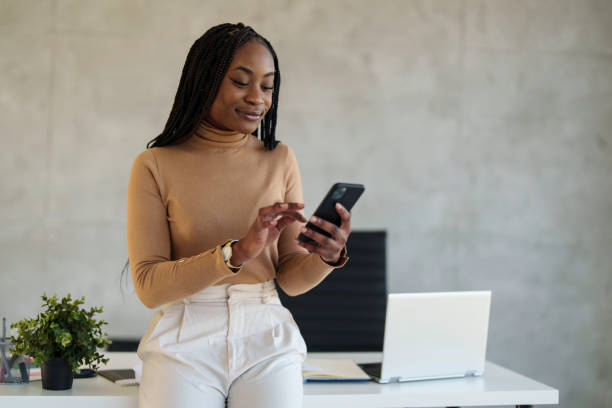 istock Professional Black Businesswoman Using Smartphone in Office 2178513316
