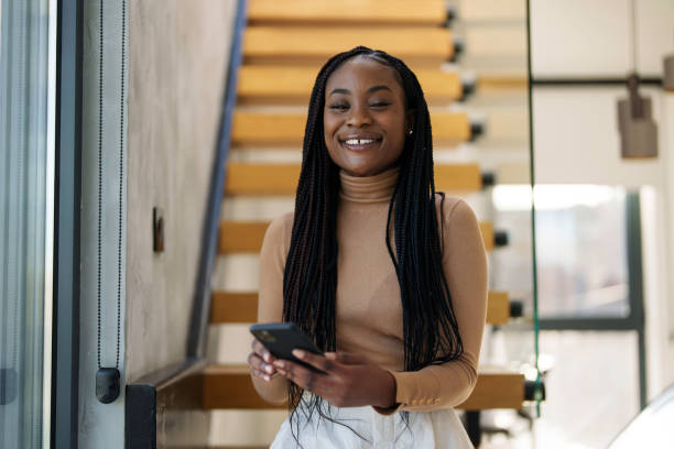 istock Professional Black Businesswoman Using Smartphone in Office Setting 2178513339