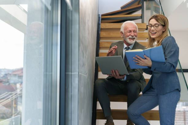 istock Senior Executive and Colleague Engage in Office Discussion 2178513396