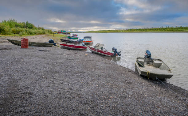 Fishing boats on the shore of the Mackenzie River at Inuvik, Northwest Territories, Canada