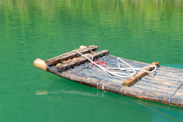 istock a bamboo raft paddling on the river 2178516181