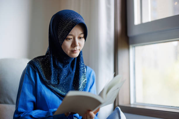 istock Young Muslim women reading at home 2178518016
