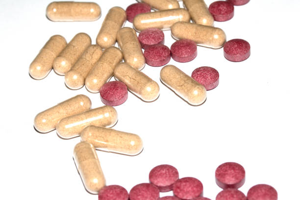 istock Vitamin Capsules and Pills on a White Background For Medication round and long shaped 2178521751