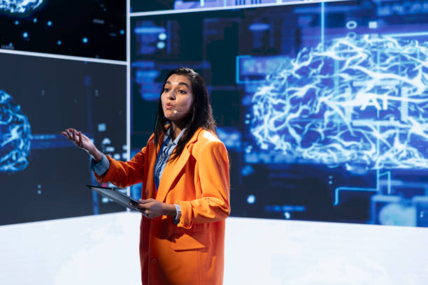 istock Presenter talks with spectators at AI convention bringing together professionals 2178525260