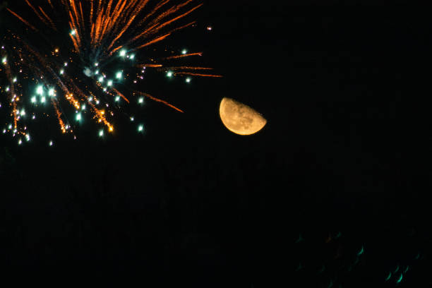 Grand celebration decorative fireworks with black background. Decorative fireworks with black background. Firework explosion with blue and red stars at crescent moon