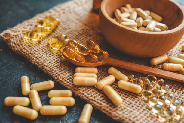 istock Natural vitamins organic on dark background 2178527685