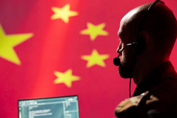 istock Chinese engineer making bot accounts spreading viruses on internet, close up 2178529501