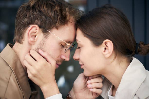 istock Young couple touching foreheads enjoying intimate moment 2178532857
