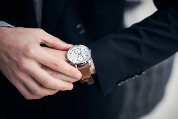 istock Businessman checking time on wrist watch in hurry 2178533498