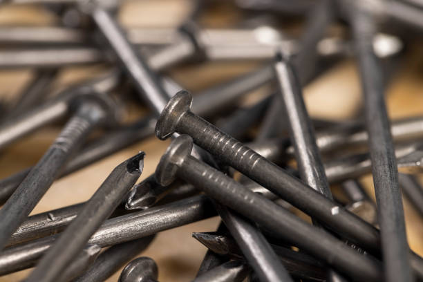 steel nails for construction work, nails made of steel for working with wooden objects, close up