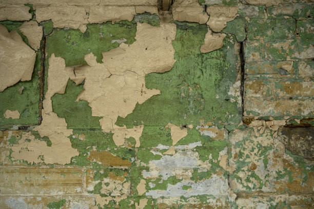 istock peeling paint patterns and texture on a traditional English brick building interior wall 2178537639