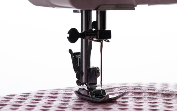 istock Sewing machine foot and needle plate with needle holder. Macro, industry. Copy space for text, overlock 2178544505