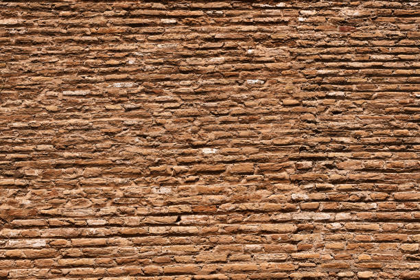 istock Background of old weathered red brick wall showing deterioration 2178545921