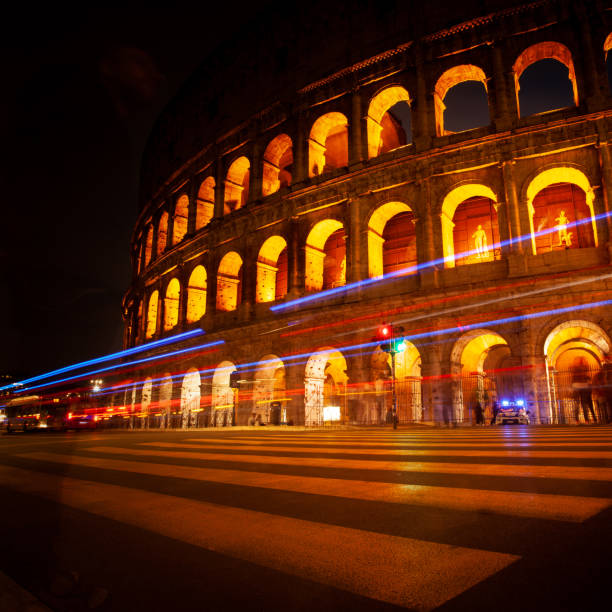 Magnificence of the Roman Colosseum at night. Colosseum illuminated at night, showcasing its grandeur against a dark sky, highlighting its ancient architecture