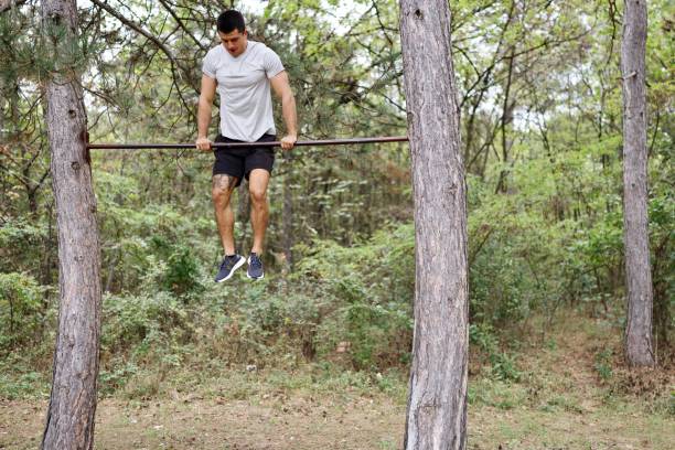 istock Strong man exercising in the forest 2178549776