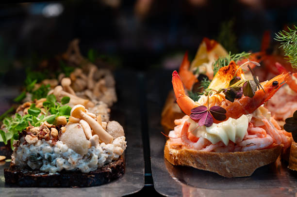 istock Smorrebrod, a classic Danish open sandwich made with dark rye bread, topped with shrimp, a layer of mayonnaise, and aromatic herbs. 2178551085