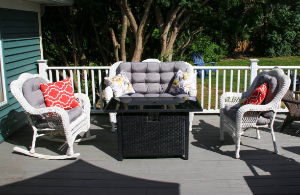istock Comfortable Outdoor Seating Arrangement on a Sunlit Deck Surrounded by Greenery 2178552538