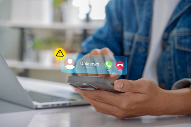 istock Scam or spam alert calls, person receiving unknown caller notification with a Warning Messages to Prevent Scams, Fraud, and Identity Theft on smartphone, Mobile Security Against Cybercrime. 2178555151