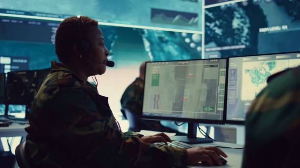 istock Female army operator registers important information from surveillance system 2178556565