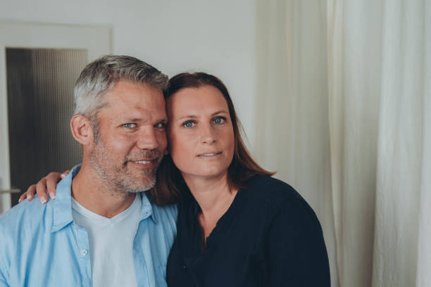 istock A happy couple is having fun at home while sitting on the floor. 2178556962