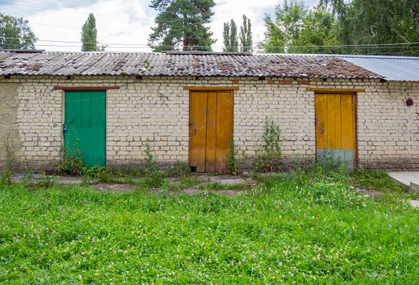 Voronezh, Russia - August 02, 2023: Detached row of utility sheds in a courtyard