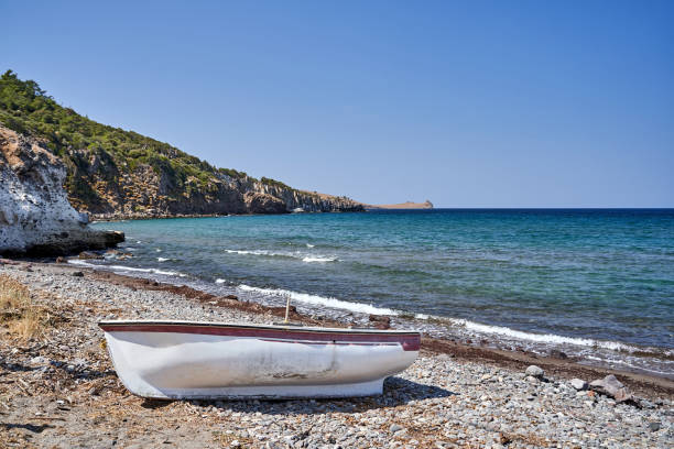 istock ruined boat on rocky coast on Lesbos island 2178568892