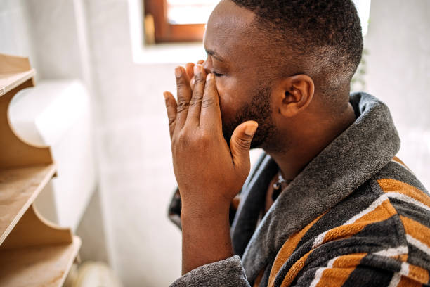 istock Young man having morning routine in bathroom at home putting cream on face 2178569116