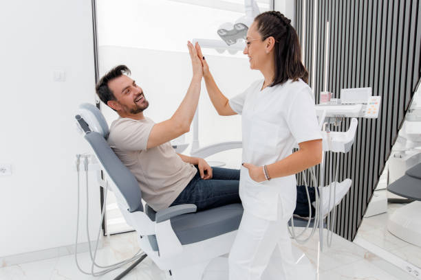 istock High-five celebration between a dentist and patient in a modern dental clinic 2178573625