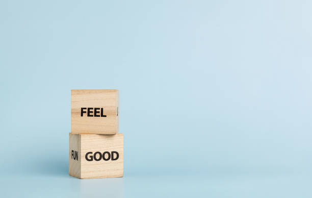 istock Wooden cubes with inscriptions Feel Good on a blue background 2178573945