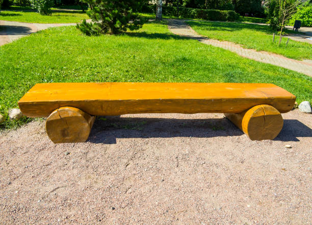 istock Park bench made of logs and half a log 2178575080