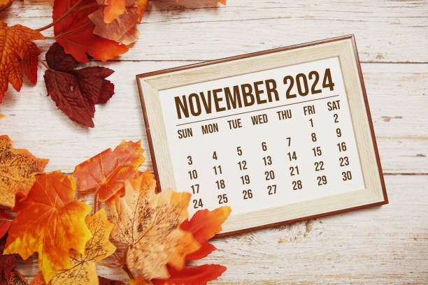istock November 2024 monthly calendar with maple leaf on wooden background 2178576749