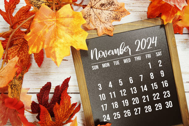 istock October 2024 monthly calendar with maple leaf on wooden background 2178576773