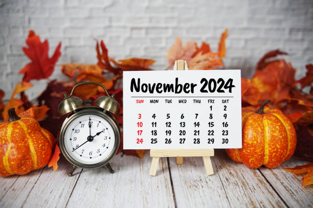 istock November 2024 monthly calendar with maple leaf on wooden background 2178576778