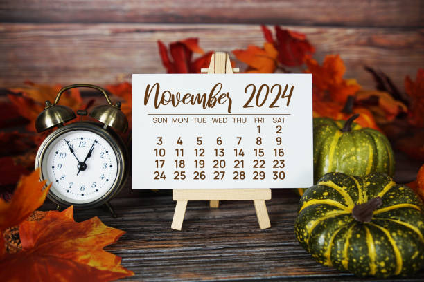 istock November 2024 monthly calendar with maple leaf on wooden background 2178576802
