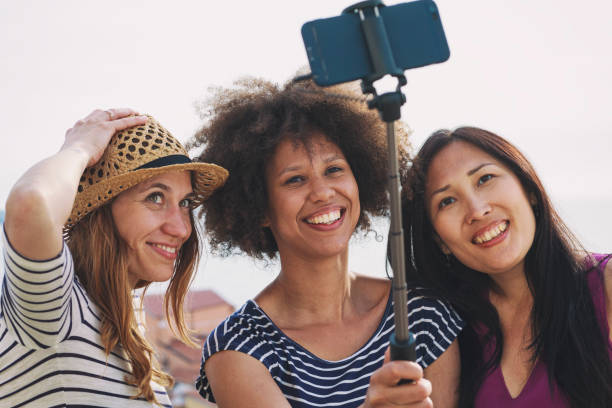 istock Mixed race female friends making a selfie 2178578184