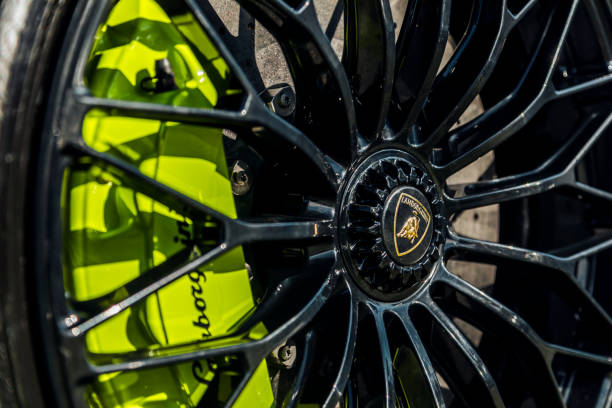 Product visualization. Sport tire on asphalt and dark background.