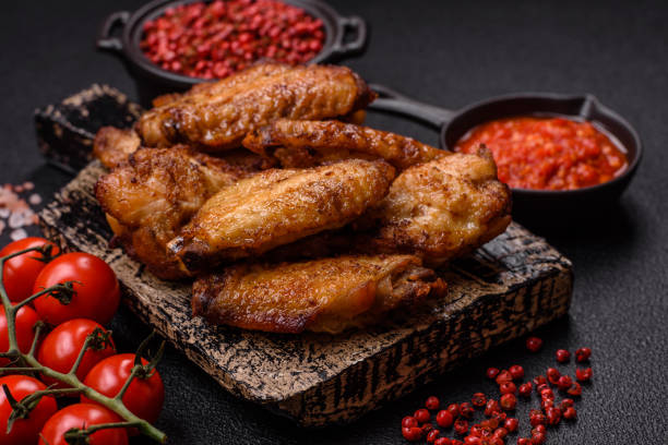 istock Grilled chicken wings with salt, spices and herbs 2178579516