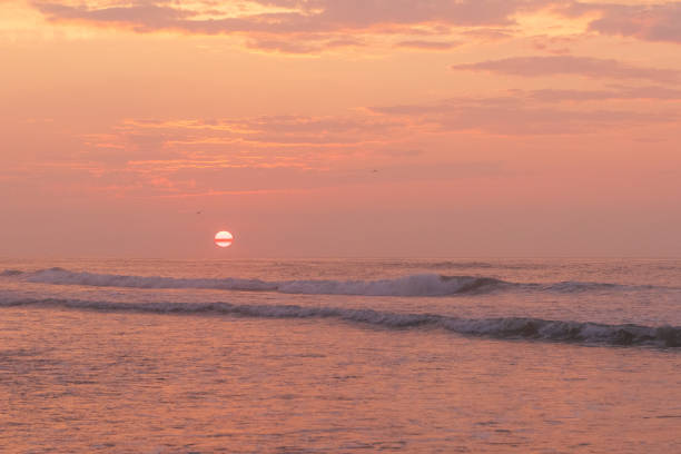 Avalon, New Jersey - Sunrise view of Ocean waves breaking onto the beach on this coastline town on the New Jersey Shore
