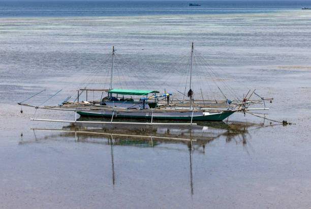 Scenic view of Komodo Island’s Pink Beach showcasing unique colored sand and tropical paradise.