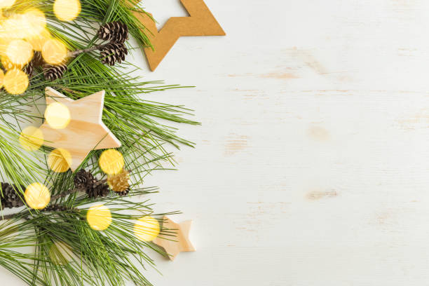 Eco christmas background with gift box and pine branches, wooden decor. Zero waste holidays